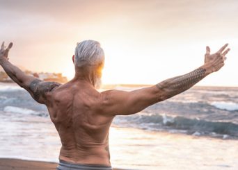 Healthy older man celebrating his health