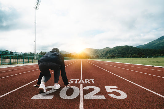 Women at the start line of a race for 2025 and living her healthiest life yet