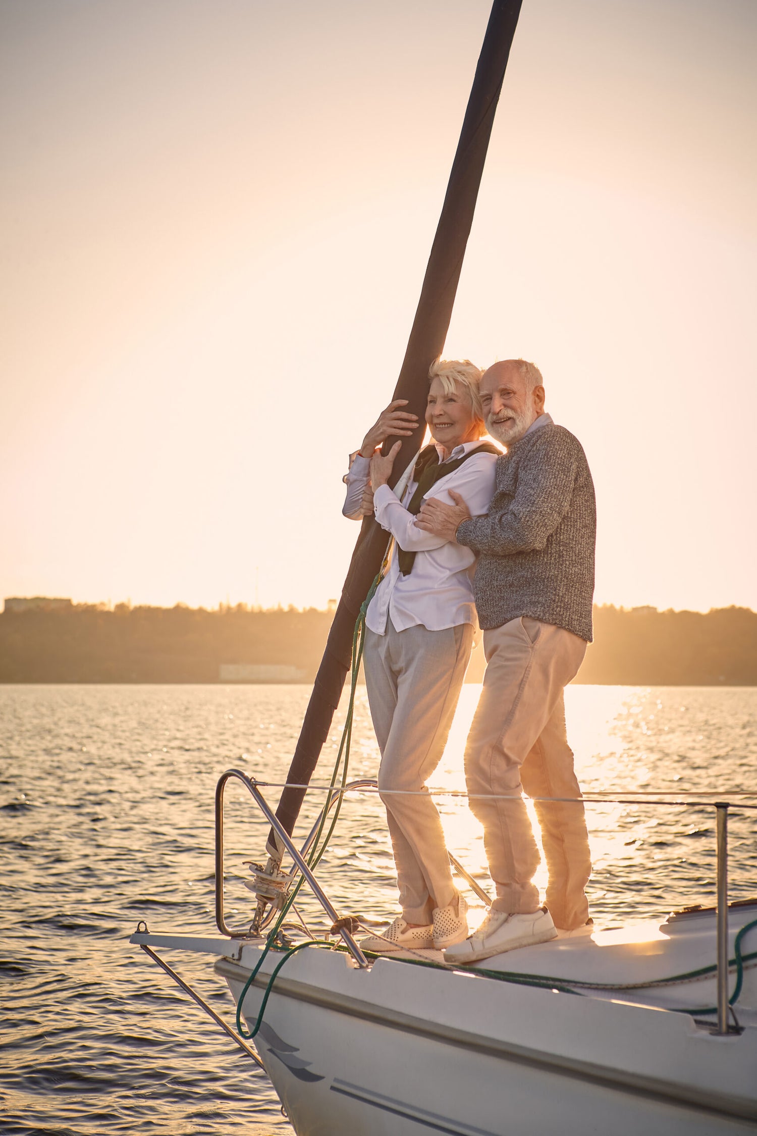 Older couple on deck of boat looking into the distance