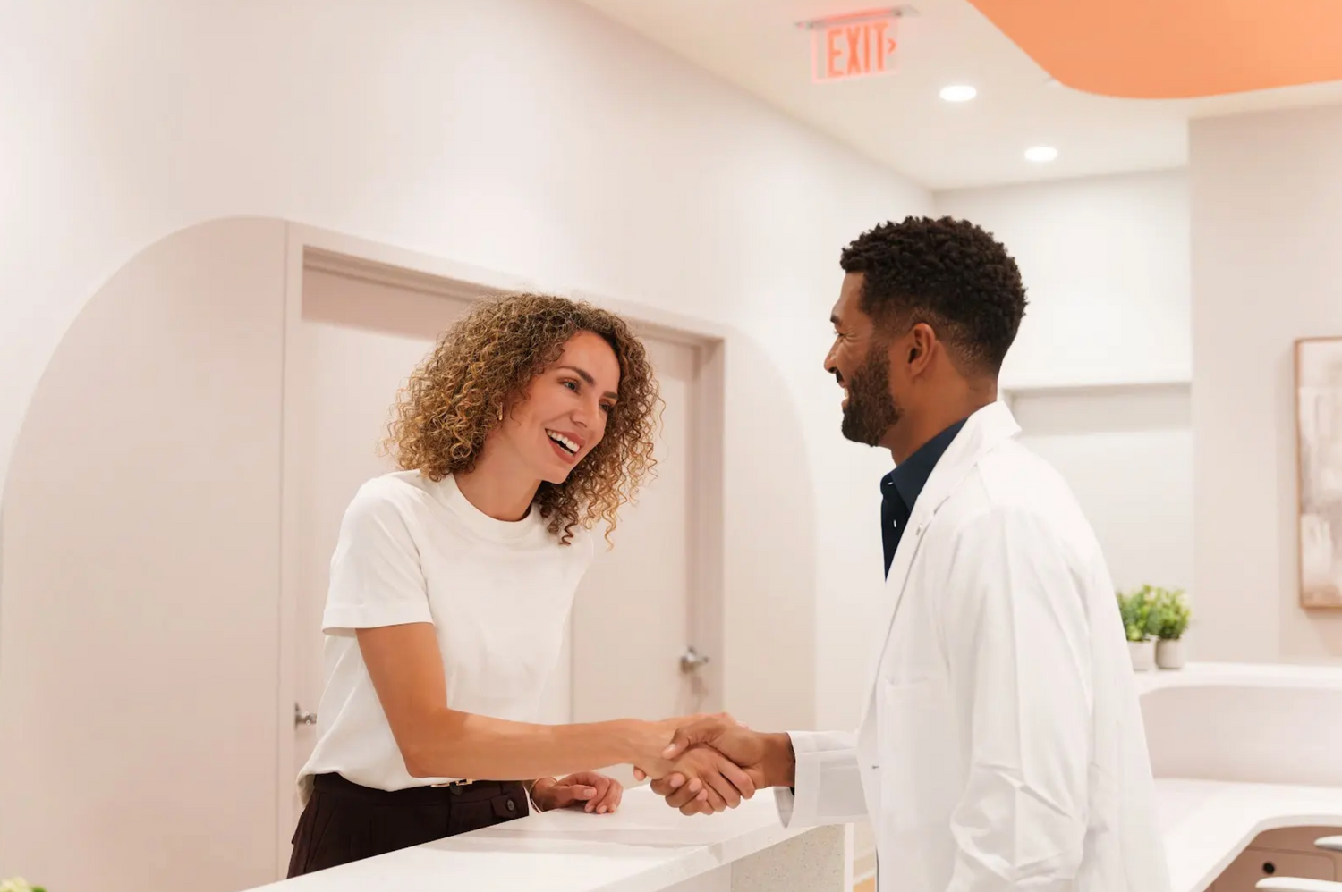 stock image of doctor greeting patient