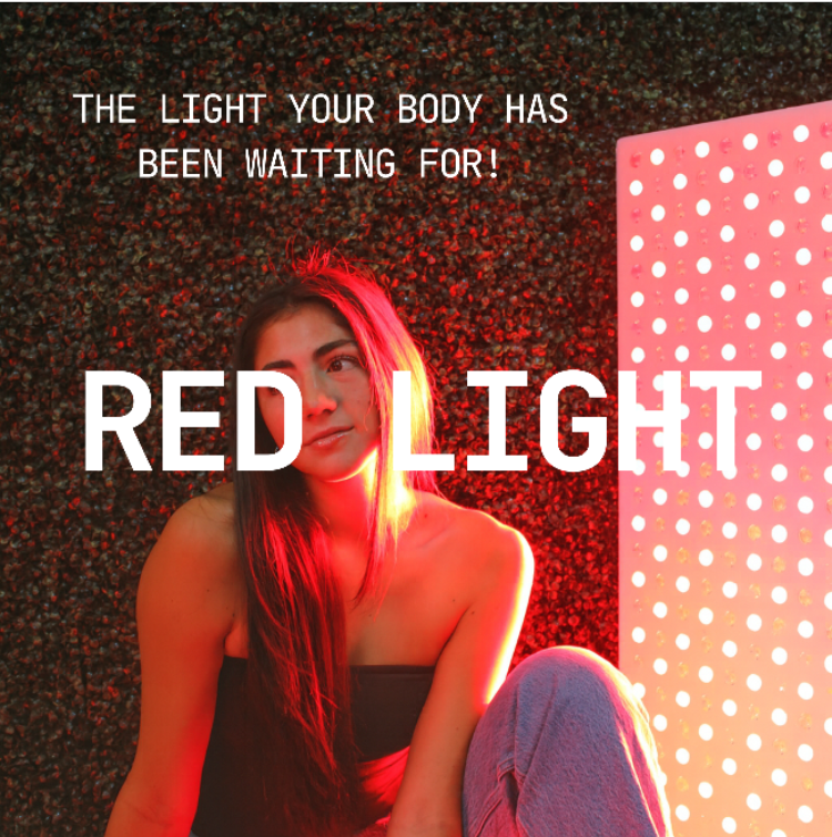 Woman sitting in front of a red light therapy panel with text 'The Light Your Body Has Been Waiting For! RED LIGHT'.