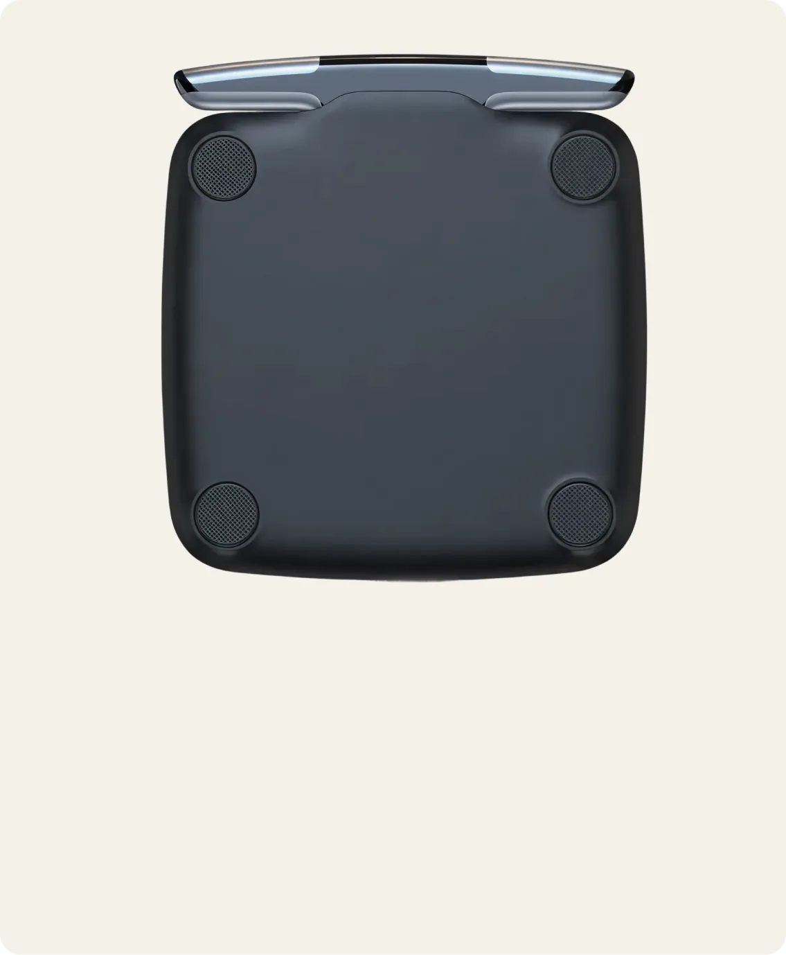 Black electronic device with a metallic top on a light beige background